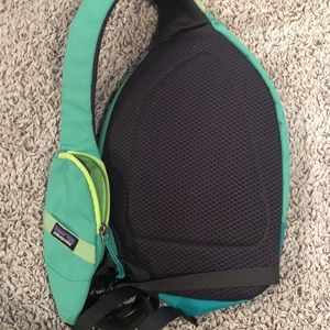 Teal Patagonia sling pack.